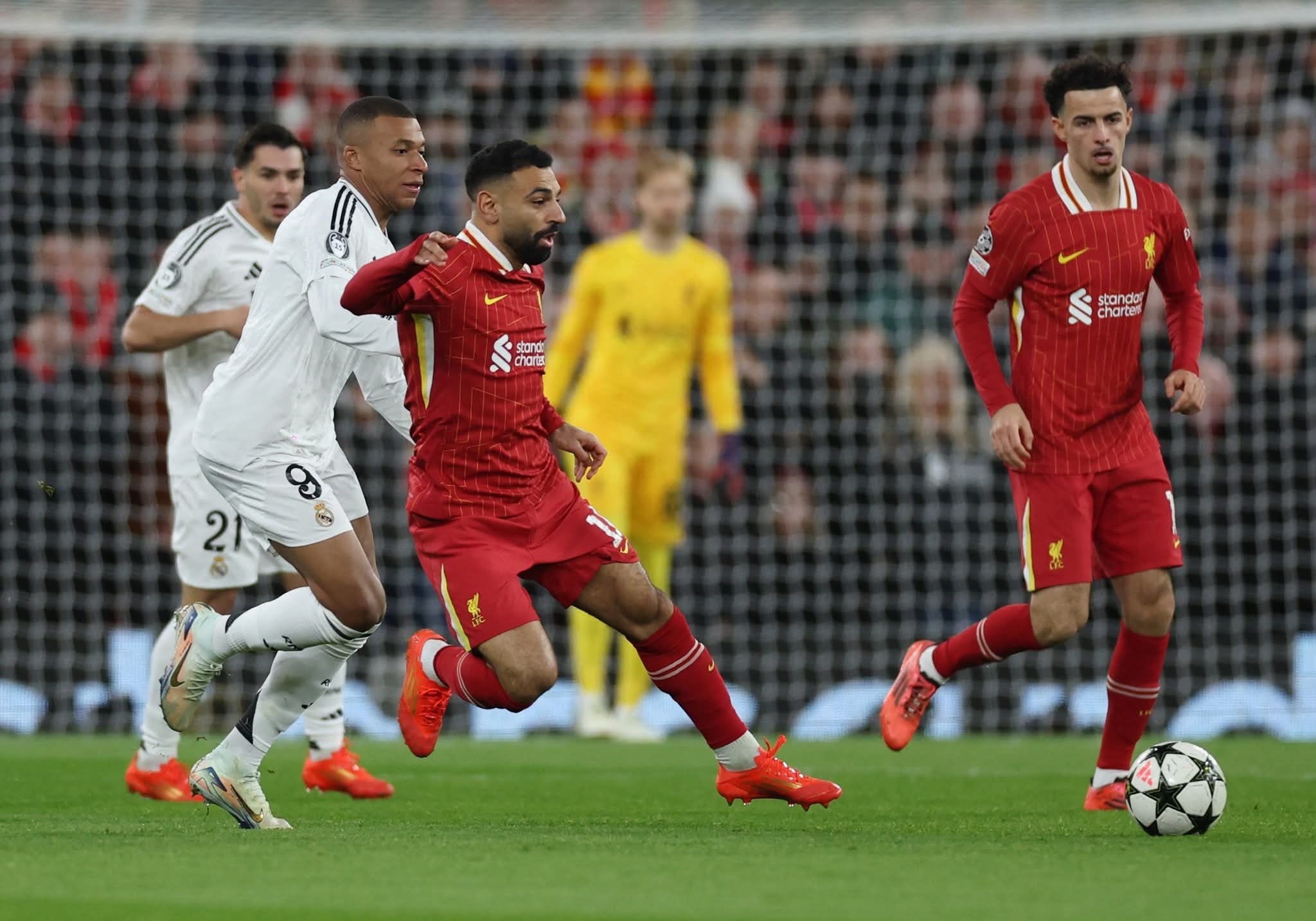 Soccer Football – Champions League – Liverpool v Real Madrid – Anfield, Liverpool, Britain – November 27, 2024 Real Madrid’s Kylian Mbappe in action with Liverpool’s Mohamed Salah Action Images via Reuters/Lee Smith